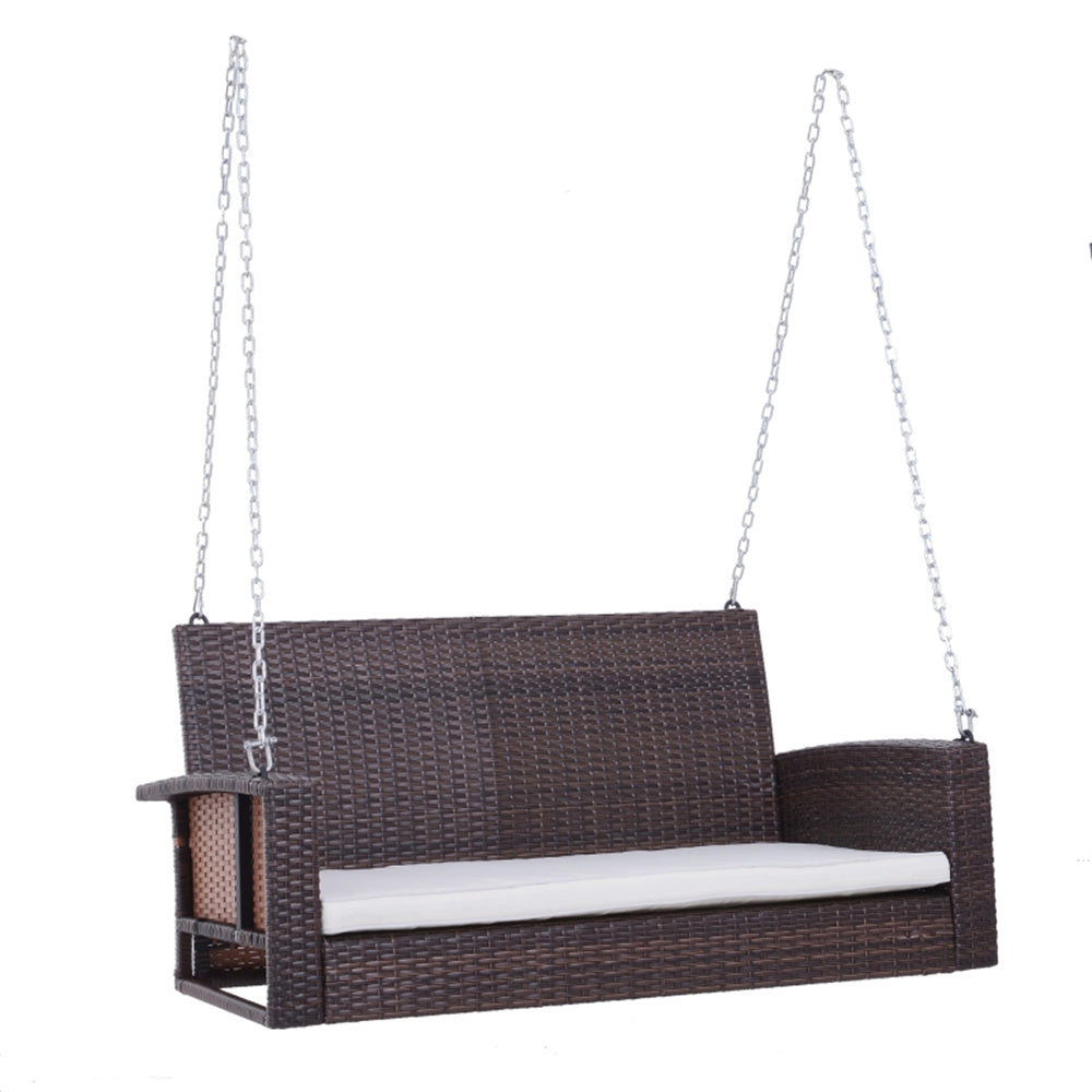 Brown wicker swing with a white cushion on a white background