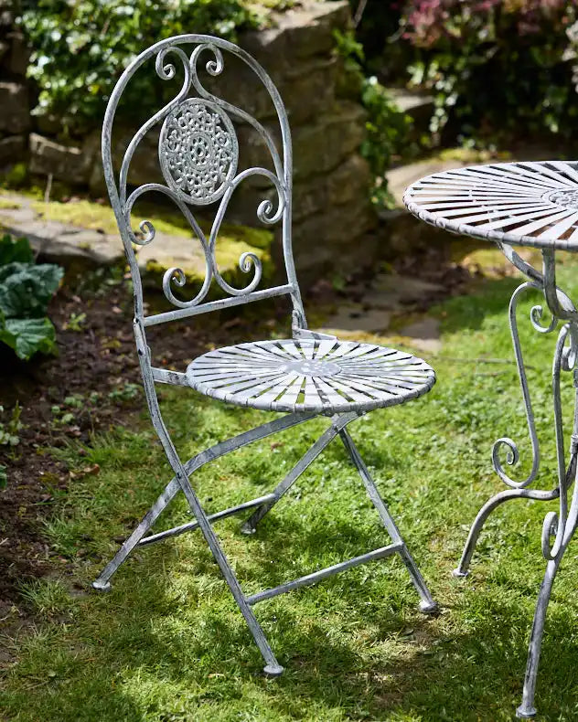 Decorative iron chair and table set ideal for garden entertaining