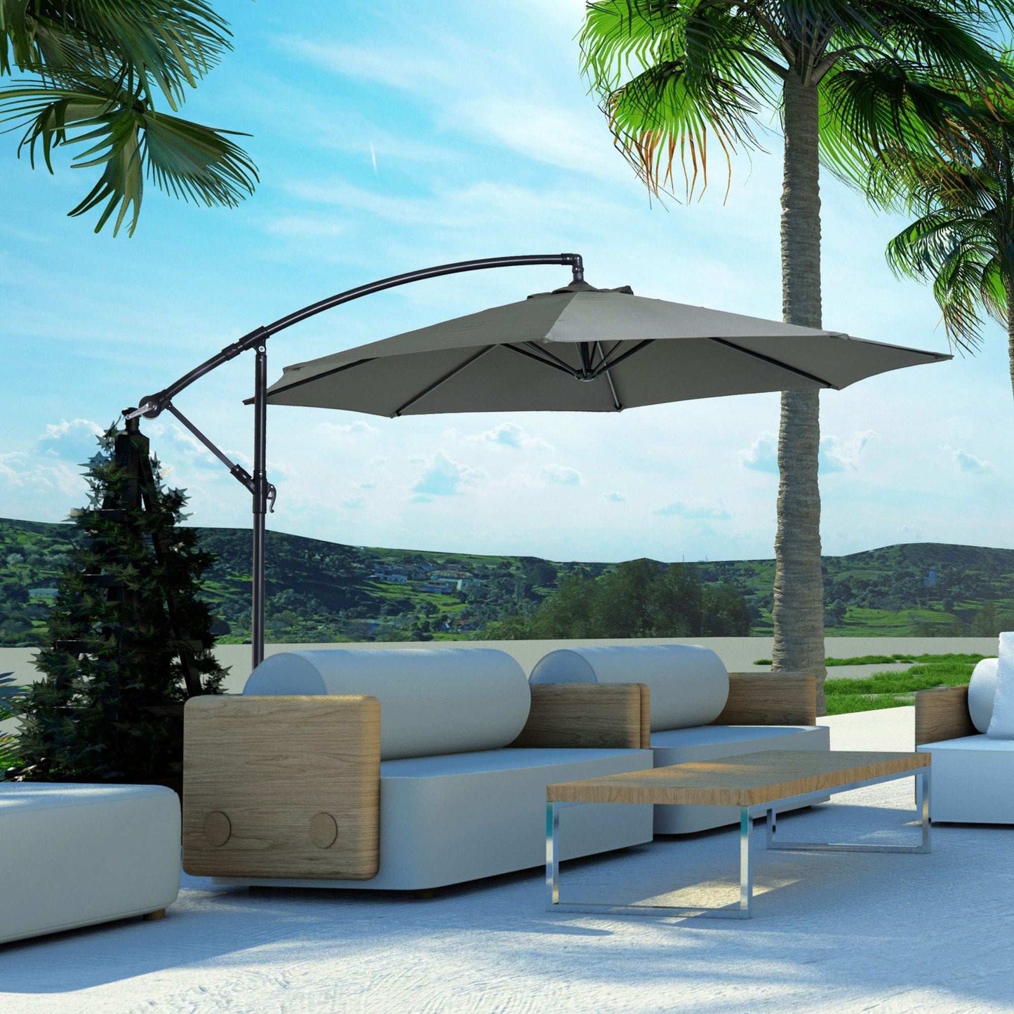 Outdoor patio set with a large umbrella, sofa, and table under palm trees.