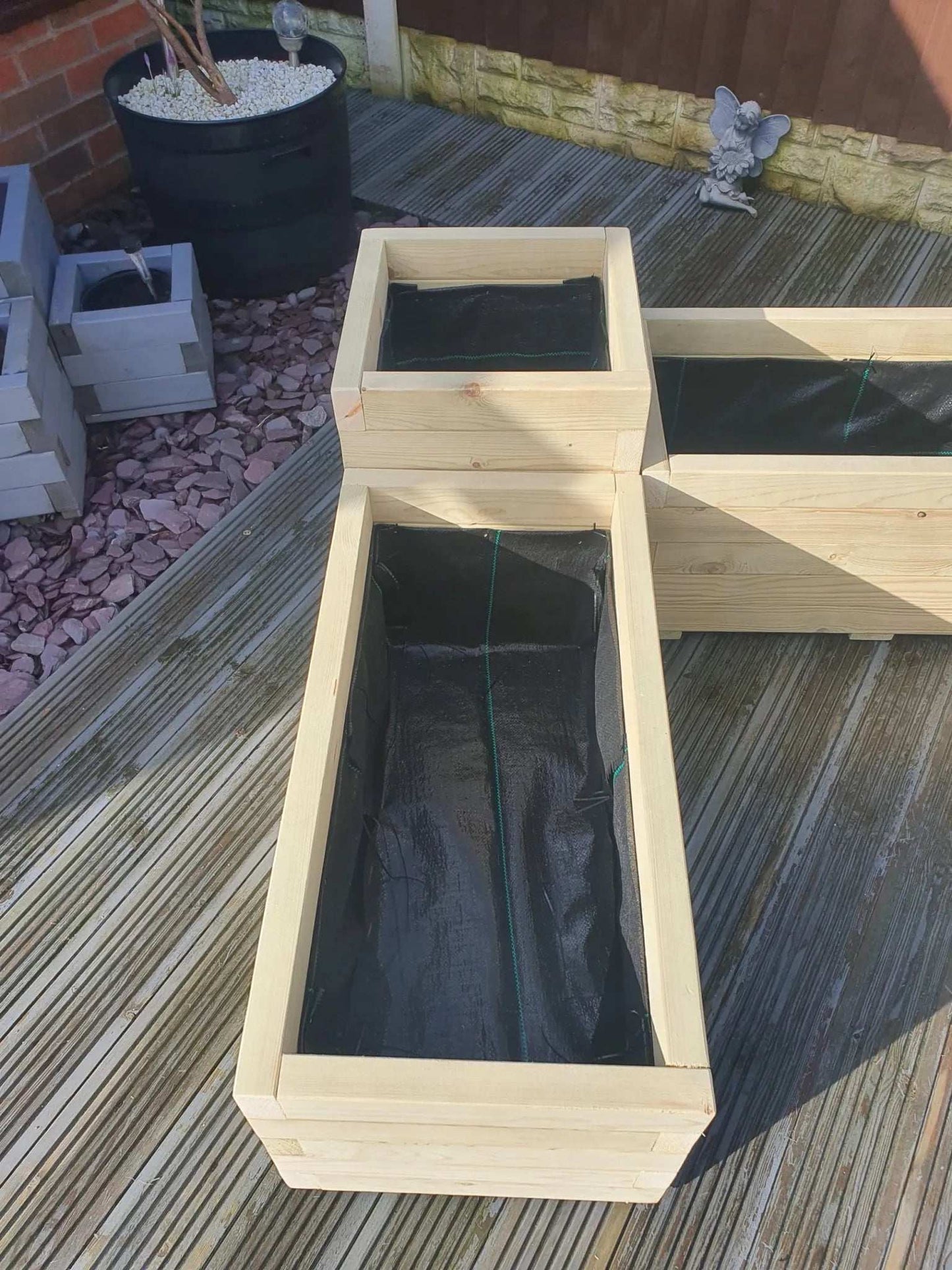 closer image Left side of Large Corner Wooden Treated Garden Planter