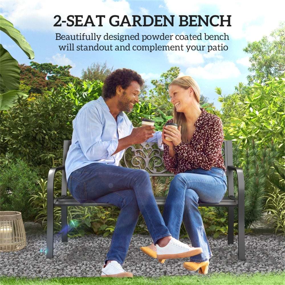 Two people sitting on a 2-seat garden bench in a garden setting.