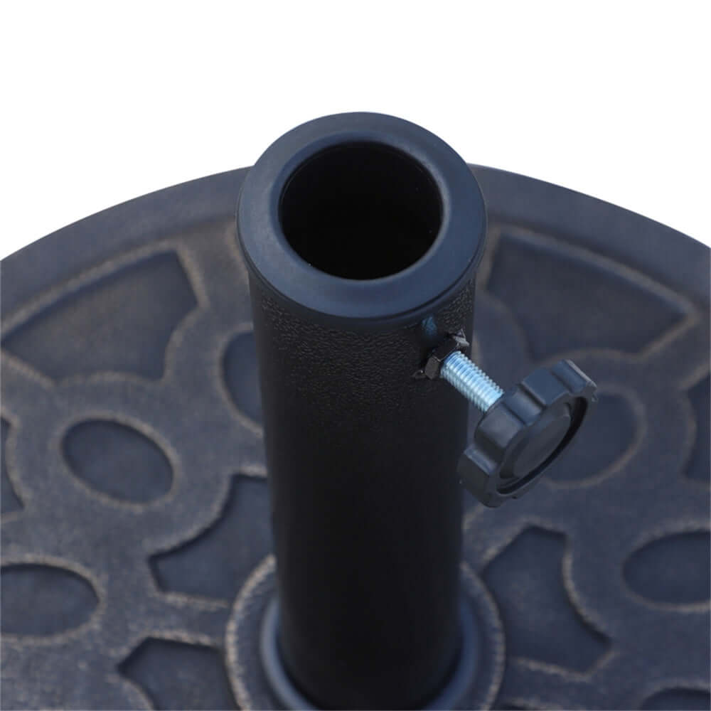 Black metal umbrella stand with a textured base on a white background