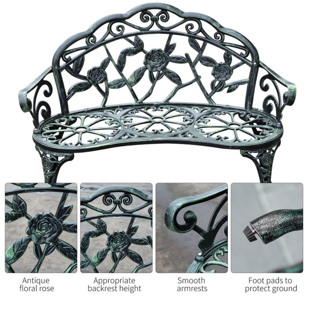 Decorative metal bench with floral patterns on a white background