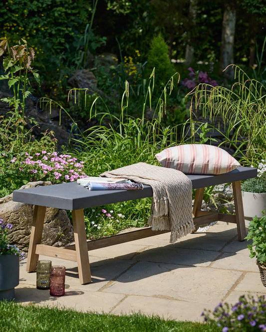 Grey garden bench ideal for garden relaxation 