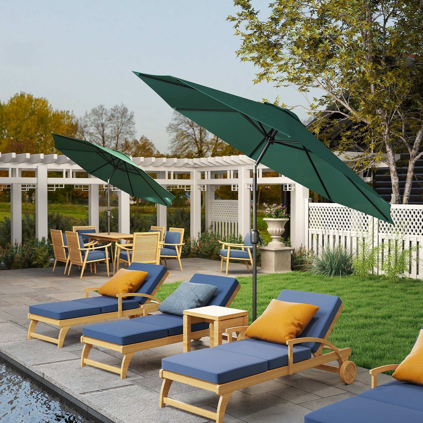 Outdoor patio set with lounge chairs, table, and umbrellas in a garden setting.