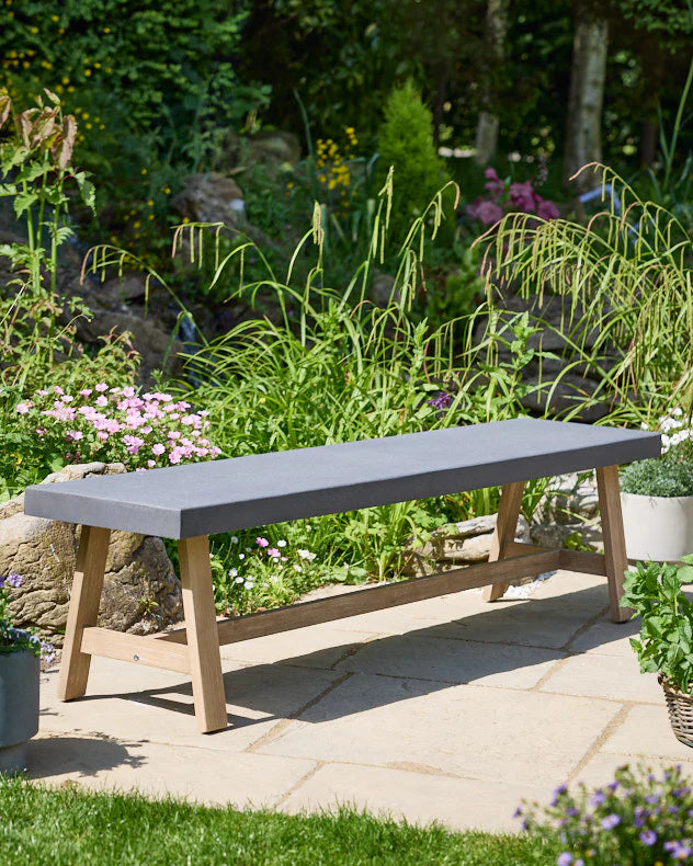 Long garden bench with grey seat and wooden legs 
