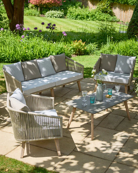Elegant outdoor patio set with sofa, 2 chairs, and table for luxury outdoor entertaining