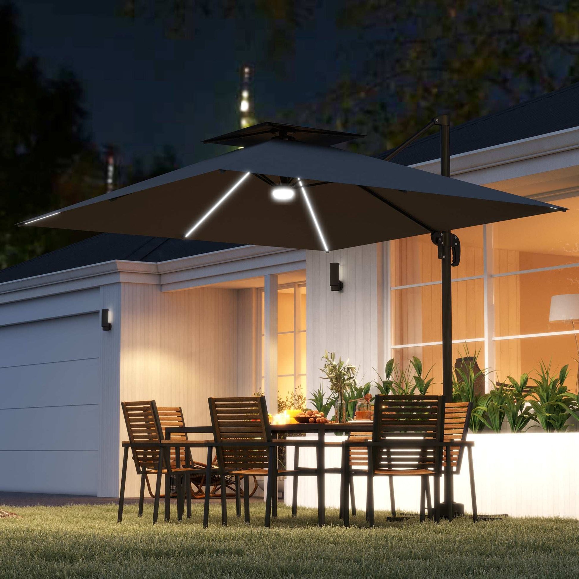 Outdoor patio set with lit umbrella and table in front of a house at night.