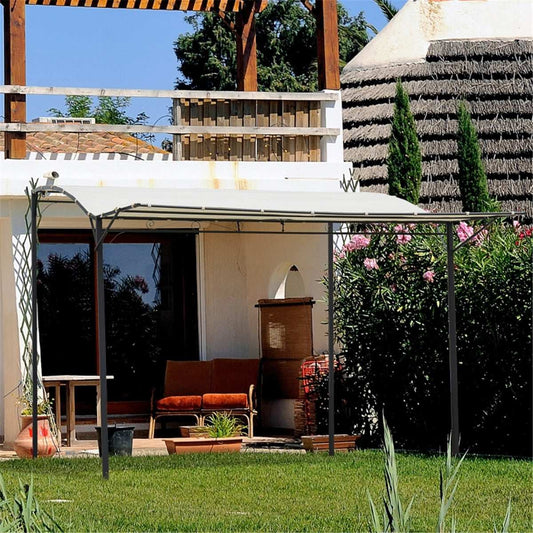 Outdoor patio area with a canopy, chairs, and garden decorations.
