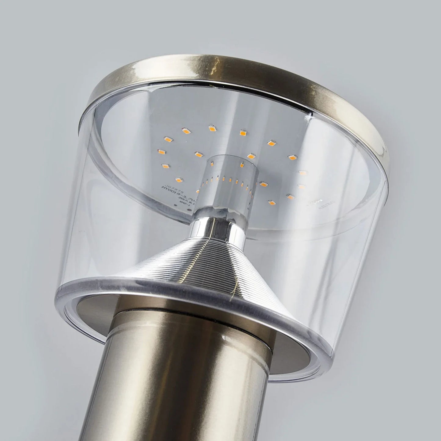 Chrome solar garden lamp on pedestal base.