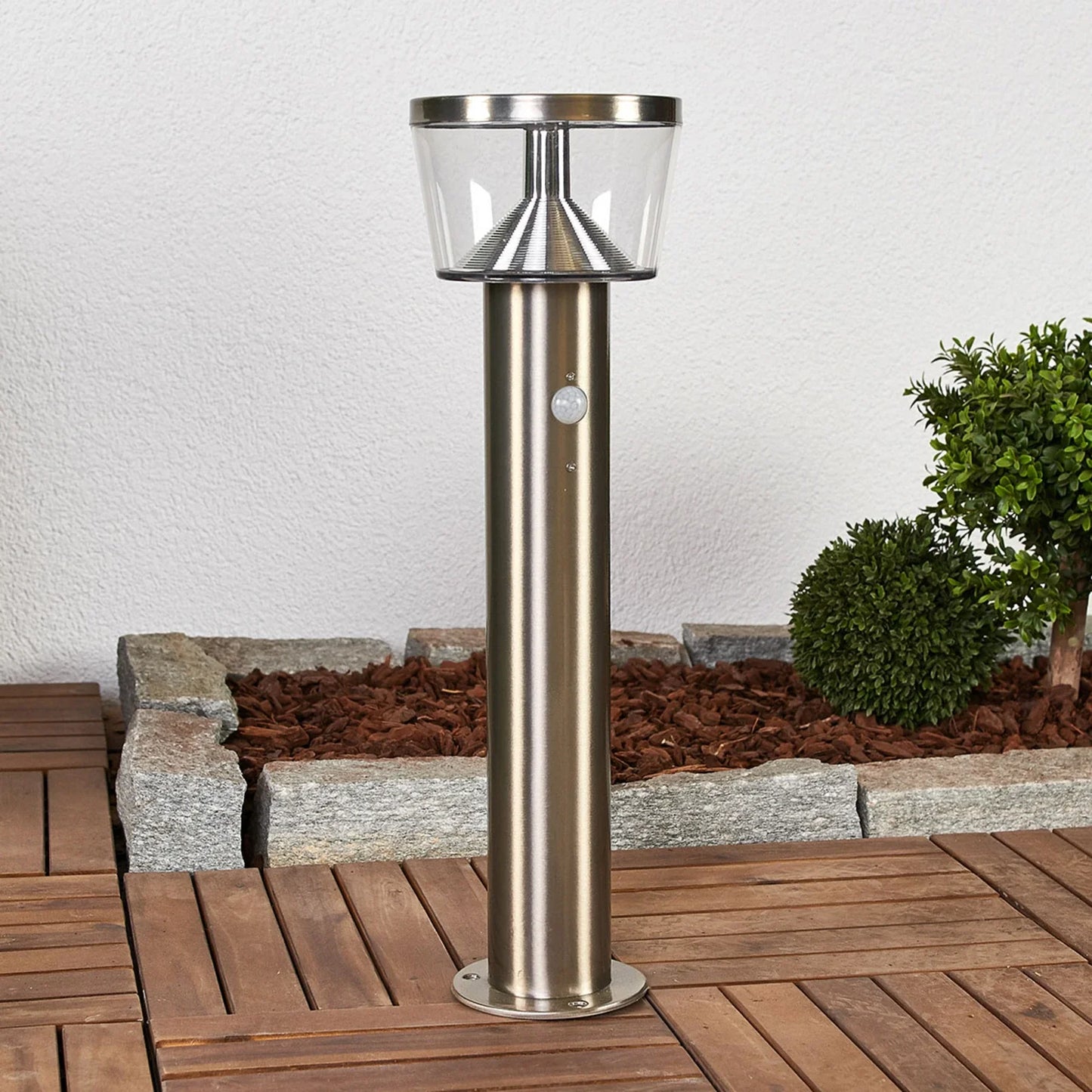 Solar garden lamp on pedestal base.
