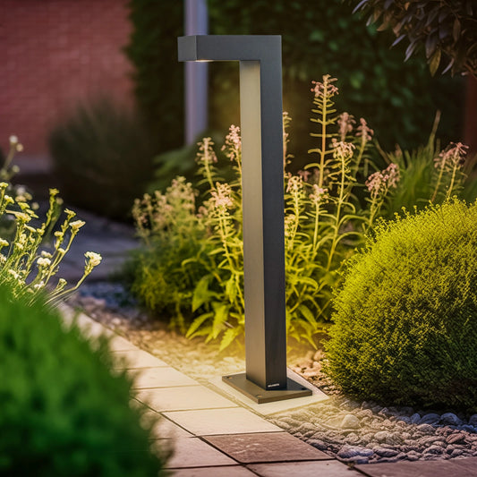 Traditional black lantern LED light on a garden path