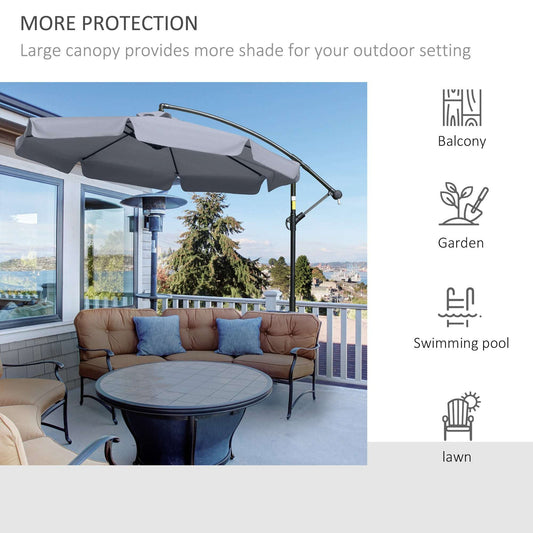 Outdoor patio setting with a large canopy providing shade, surrounded by furniture and decor.