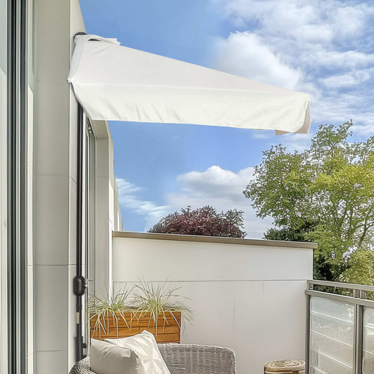 Balcony with a white retractable awning, plants, and a clear blue sky.